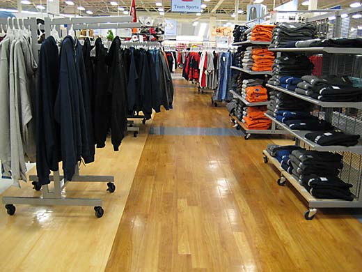 commercial hardwood flooring in retail clothing store.