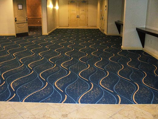 hotel lobby with patterned carpet.
