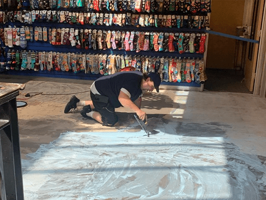 one of our master flooring installers prepping a commercial floor.