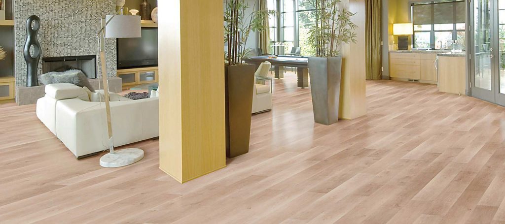 vinyl flooring in open plan home living, dining, and kitchen.
